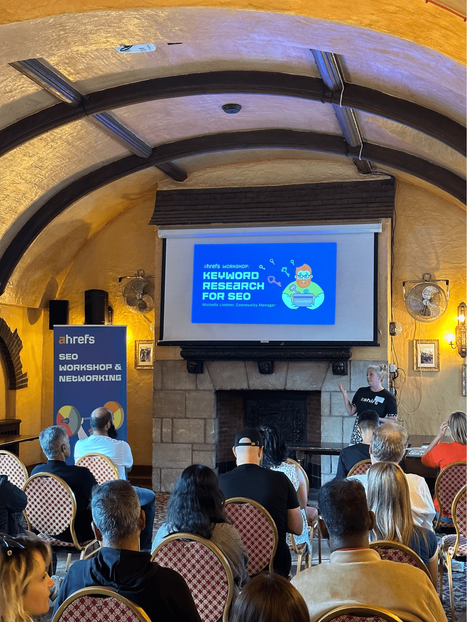 Dear BrightonSEO, You've Come a Long Way, Baby | Michelle Lindner giving a speech in front of a crowd