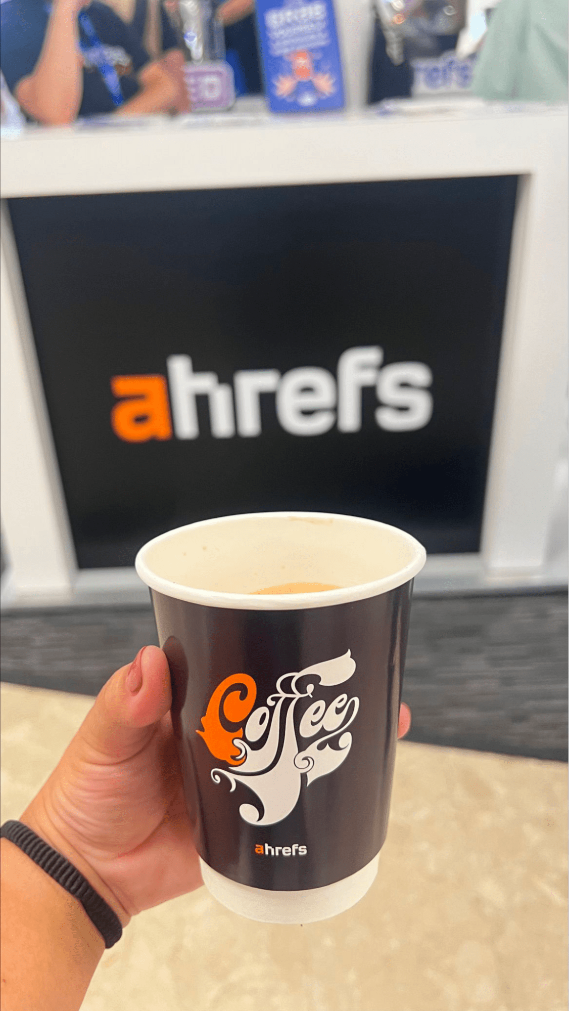 Dear BrightonSEO, You've Come a Long Way, Baby | Ahrefs' coffee cup