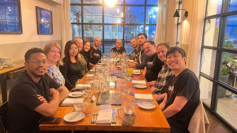 Dear BrightonSEO, You've Come a Long Way, Baby | Ahrefs team sitting around the dinner table at the Salt Room