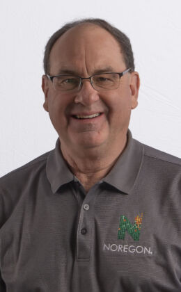 Person wearing a gray polo shirt.